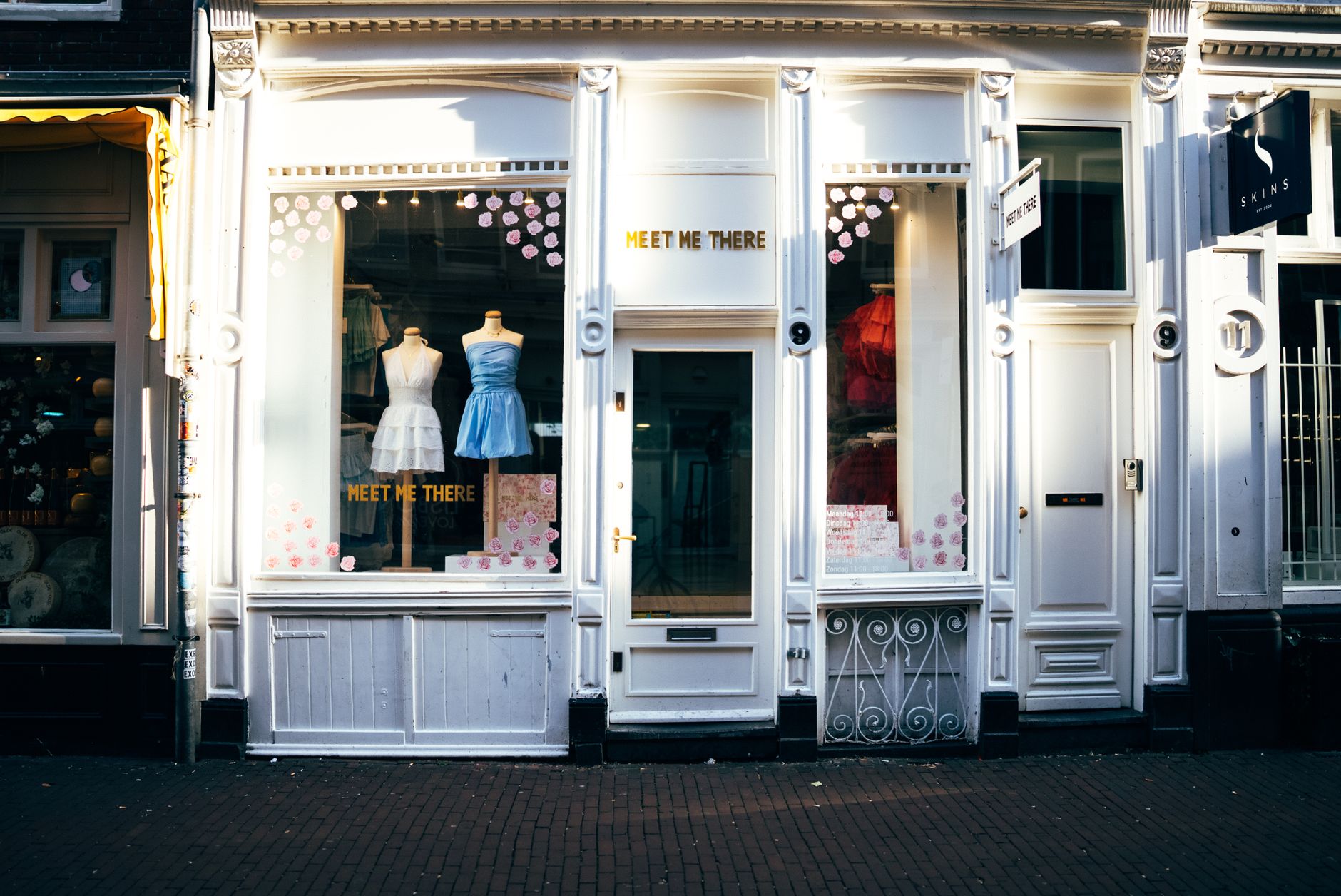 Illuminated white shop front at night