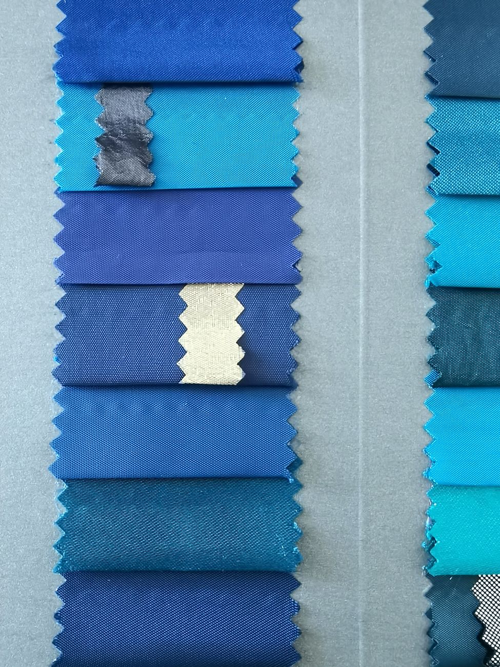 Fabric swatches in shades of blue with pinked edges