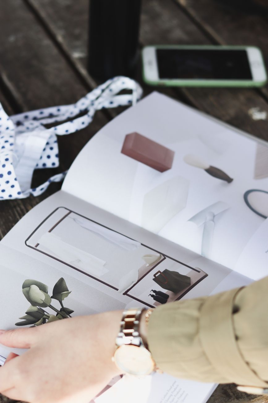 Brand guidelines and stationery laid out on a desk