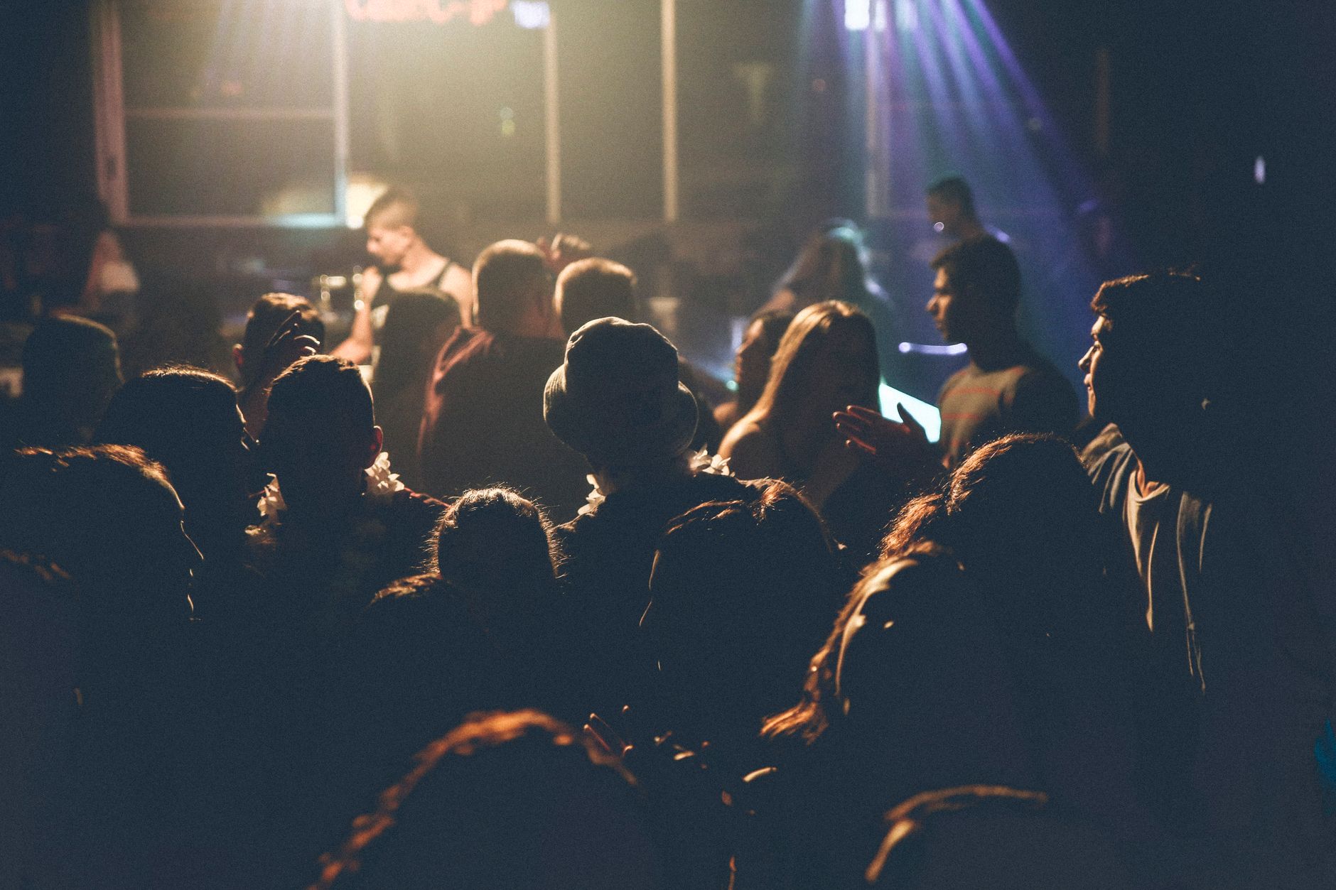 Crowd at a concert lit by stage lights