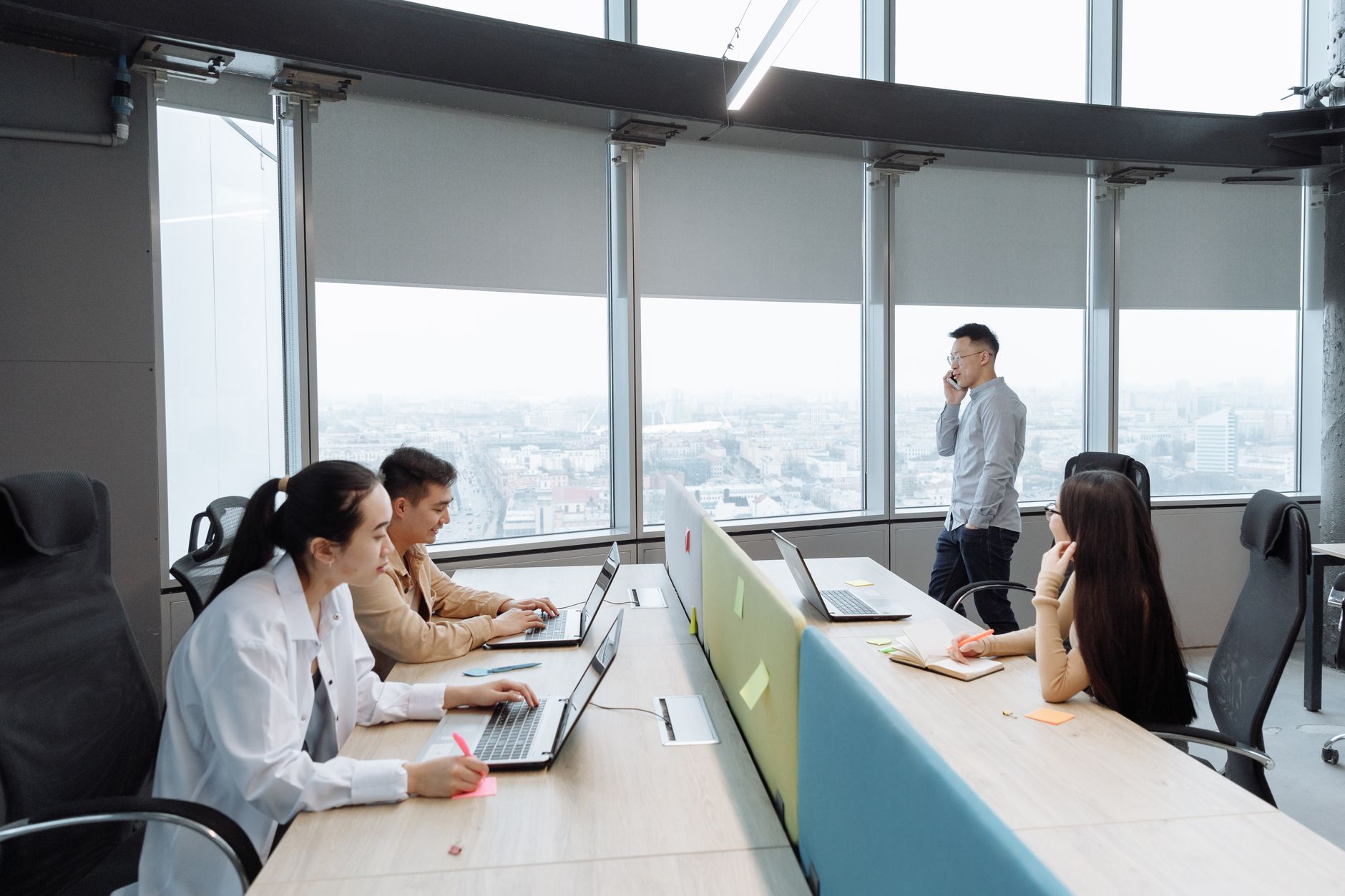 A team working together at desks in a bright open office